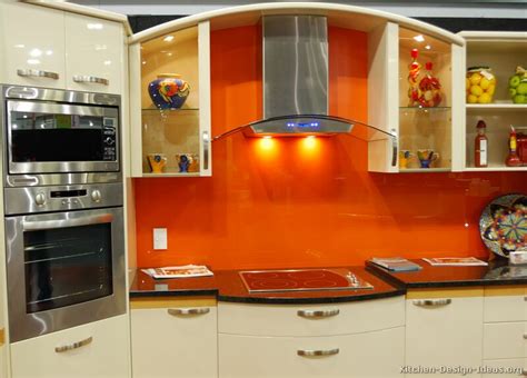 Standard cabinet doors swing, however there are also turn up corner drawers doors, and pocket doors, can make cupboards more functional. The Granite Gurus: 6 Orange Colored Kitchens