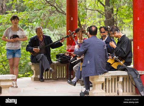 A Chinese Groupband Of Musicians Play Traditional Chinese Music Erhu