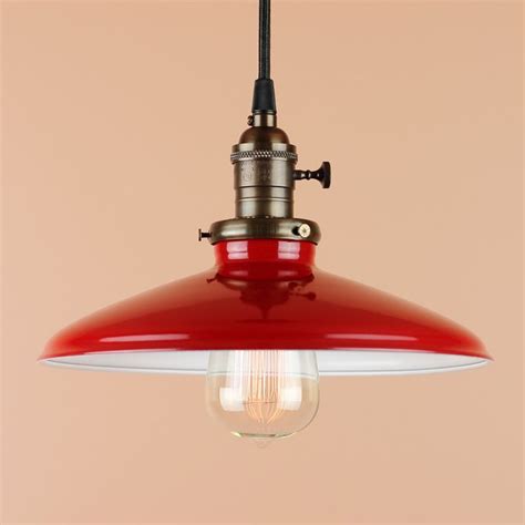 A Red And White Light Hanging From A Ceiling Fixture With An Orange