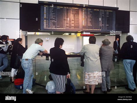 Arrivals With Airline Arrivals Board Heathrow Airport 1980s Stock