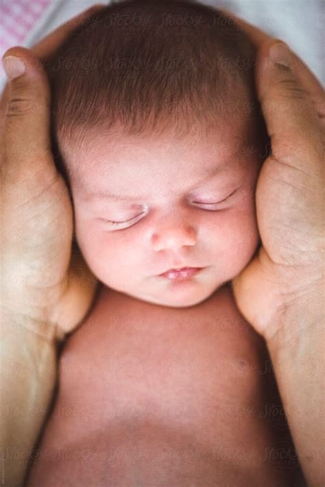 Hands Holding A Newborn Baby Del Colaborador De Stocksy Simone Wave Stocksy