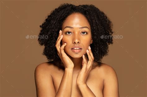 Sensual Pretty Topless Young African Woman Touching Her Face Stock