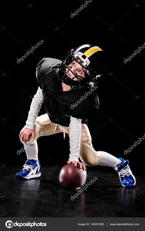 Boy Playing American Football — Stock Photo © Arturverkhovetskiy 142451263