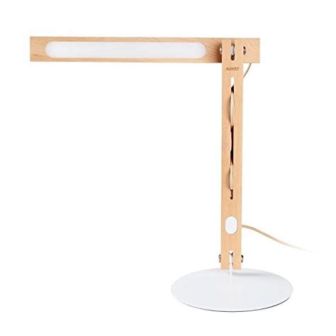 The aukey desk lamp is a nice product and it comes in at a great price for a desk peripheral; AUKEY Desk Lamp, LED Table Lamp with Natural Wood Design ...