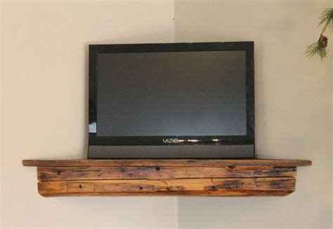 Learn how to make a diy corner entertainment center by creating two floating corner shelves. Corner floating shelf...great use of space, clean look ...