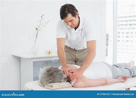 Physiotherapist Massaging A Senior Womans Shoulder Stock Image Image Of People Lying 37206735