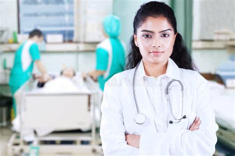 Female Doctor Looks Confident In Patient Room Stock Image Image Of