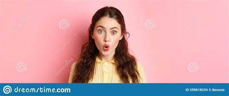 Close Up Portrait Of Surprised Brunette Girl Saying Wow Folding Lips And Stare Amazed At Camera