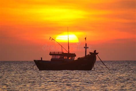 Fishing Boat In The Background Of A Huge Sunset Stock Photo Image Of