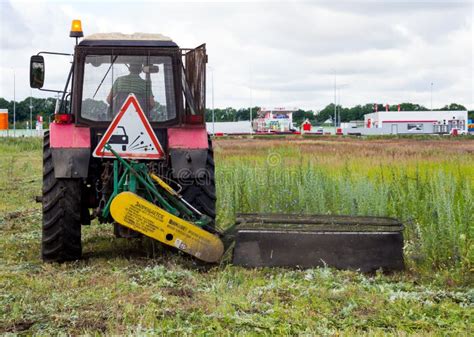Tractor Mowing Grass At The Curb Editorial Stock Image Image Of
