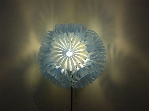 I made a hole in the bottom to place the lamp. Beautiful plastic bottle lamps. This lamp is made of 10 ...
