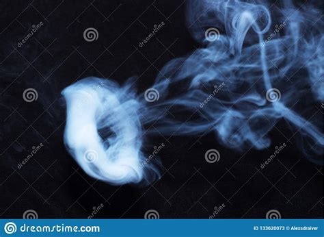 Puff Of Black Abstract Smoke Over White Stock Photo