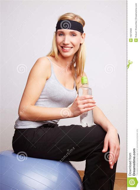 Woman On Gym Ball With Water Bottle Stock Image Image Of