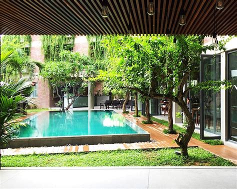 Atlas Hotel Hoi An Is An Impressive Building Surrounded By Greenery