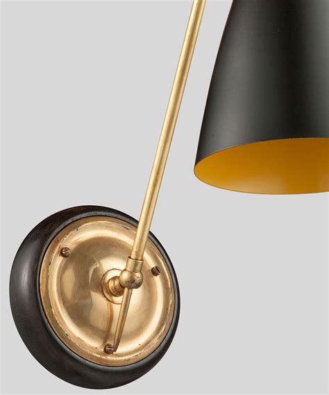 This post contains affiliate links, to learn more, see my disclosure statement. Black Metal / Angled Brass Arm Sconce :: Obsolete