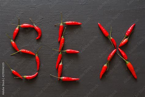 word sex red hot chili peppers on black background on black table swx letter arranged from red