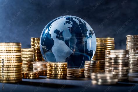 Globe And Stack With Coins Money Makes The World Go Round Stock Photo Adobe Stock