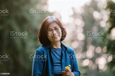 Cheerful Portrait Of Senior Korean Woman Stock Photo Download Image
