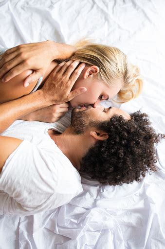 Everyone gets kissed see the wet competition in love island sweden 2018 duration. Beautiful Couple Kissing And Lying In Bed Stock Photo ...