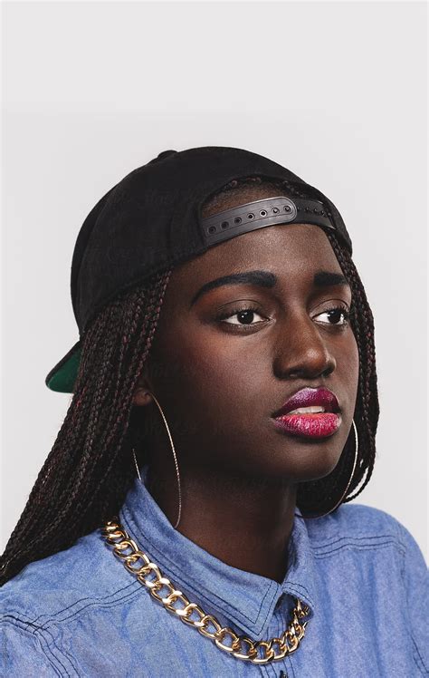 A Portrait Of A Pretty Black Girl With A Backward Baseball Cap By Stocksy Contributor A Model