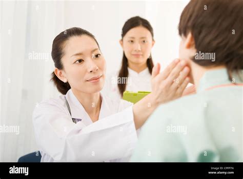Female Doctor Examining Patient Stock Photo Alamy