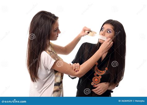 Girl Putting Duct Tape Over Her Friends Mouth Stock Image Image Of