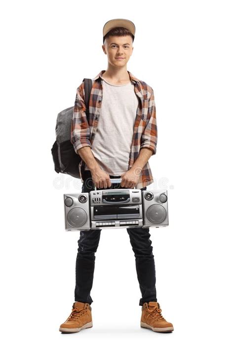 Guy Holding A Boombox On His Shoulder And Sitting On A Wooden Be Stock