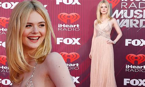 Elle Fanning Dazzles In Daring Blush And Silver Hued Gown At