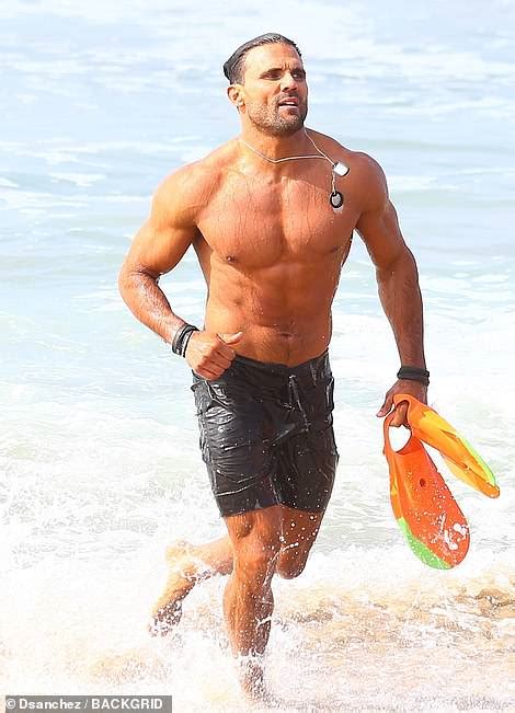 Former Baywatch Star Enjoys The Good Life While His Ex Wife Appears