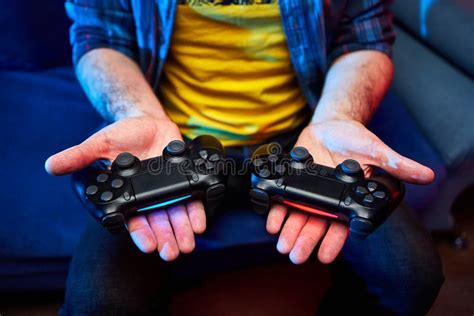 Gamer Holding Gamepad Controller Or Videogame Joystick Console In