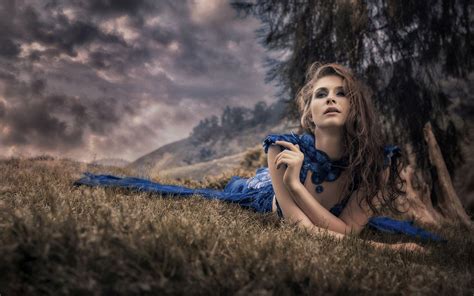 Hd Girl Lying On The Field In A Blue Dress Wallpaper