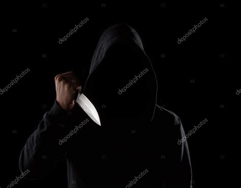 Dangerous Hooded Man Holding Knife Stock Photo By ©ijdema 30136337