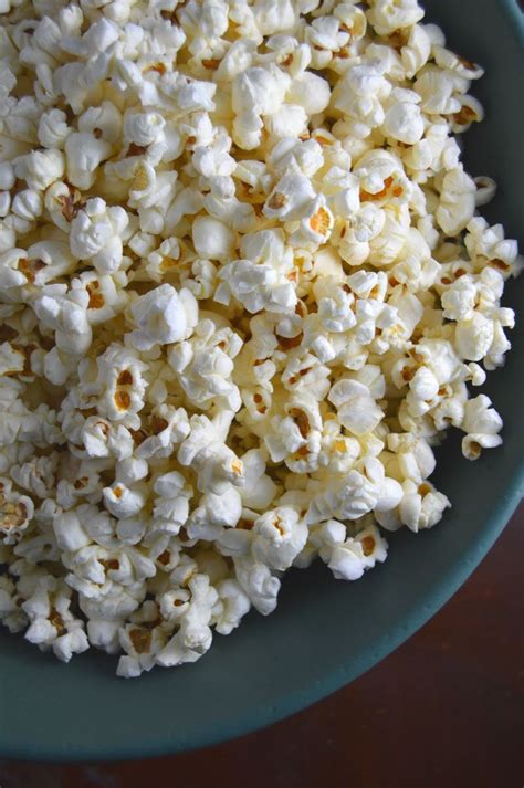 A Bowl Filled With Popcorn Sitting On Top Of A Table