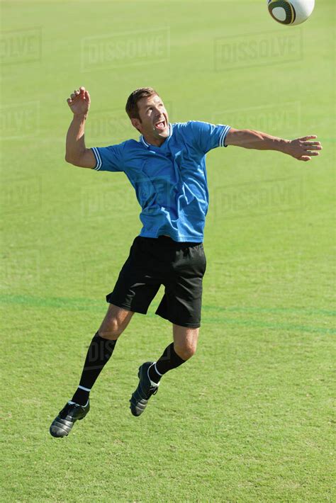 Soccer Player Heading The Ball Stock Photo Dissolve