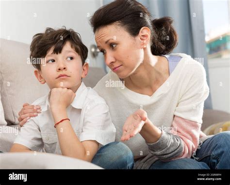 Mother Consoling Sad Son Stock Photo Alamy