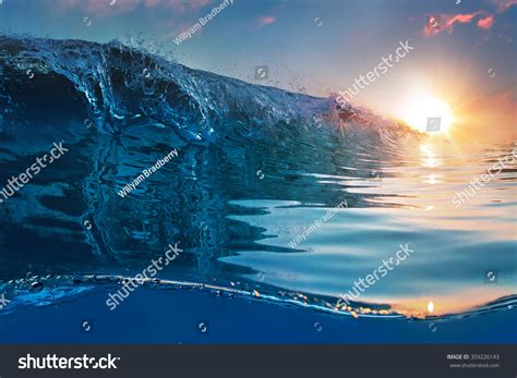 Beautiful Blue Ocean Surfing Wave Under Stock Photo