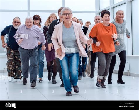 a group of seniors get ready to run. full length Stock Photo - Alamy