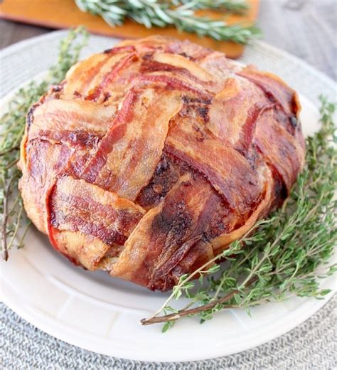 Wrap the bacon slices up and over the meat mixture. Bacon Wrapped Meatloaf Recipe - WhitneyBond.com