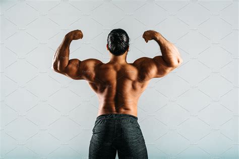 Rear View Of A Male Bodybuilder ~ Sports Photos ~ Creative Market