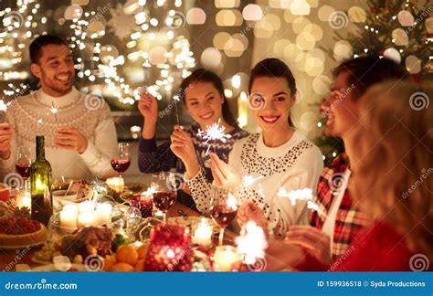Happy Friends Celebrating Christmas At Home Feast Stock Photo Image
