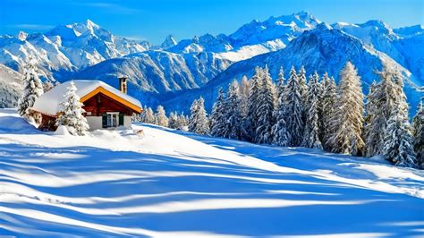 Beautiful Snow Covered House Trees Mountains Slope Under Blue Sky