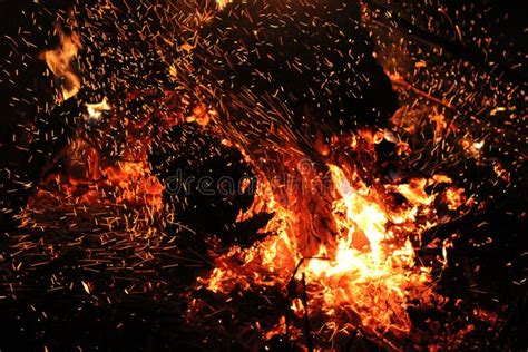 Burning Red Hot Sparks Rise From Large Fire At Night Stock Image
