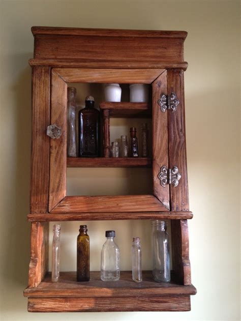 It has a small lip so things can't fall forward. Antique medicine cabinet with our collected drug bottles ...