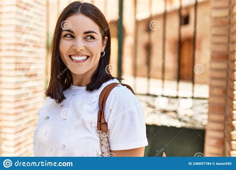 Young Hispanic Girl Smiling Happy Standing At The City Stock Photo