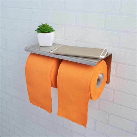 This toilet paper stand from japanese brand yamazaki only holds three rolls, but what it lacks in capacity it makes up for in looks. Simple and Gorgeous Best Toilet Paper Holder Ideas