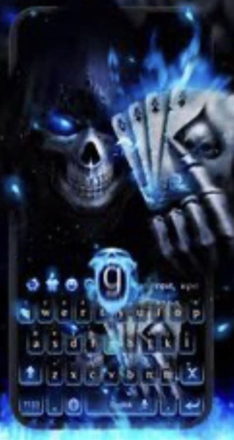 Badass Flaming Blue Skeleton Next To A Keyboard With The Letter “g
