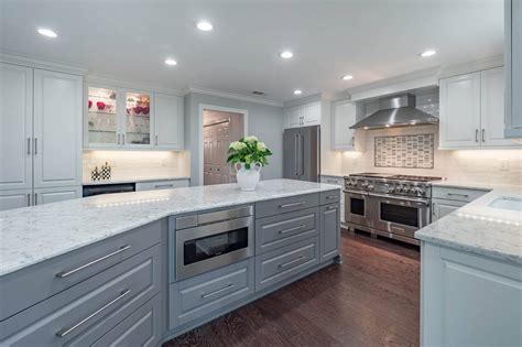 This kitchen is very well organized and with all the storage space provides plenty of options for optimal kitchen appliances and dishware organization. Contemporary White & Gray Kitchen - Cheryl Pett Design