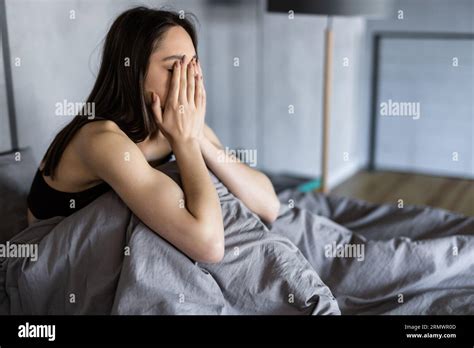 Funny Tired Lazy Asian Young Woman Waking Up In Bed Sleepy Morning