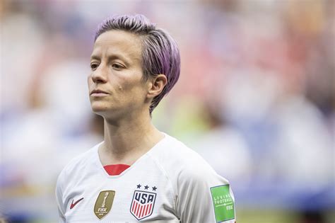 Megan rapinoe, wearing a thom browne suit, poses for a picture before the marriage ceremony if ali krieger and ashlyn harris. Megan Rapinoe to Reportedly Write Two Books about Herself