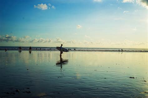 Surfer Back Home At Kuta Beach Bali Indonesia In The Sunset Time
